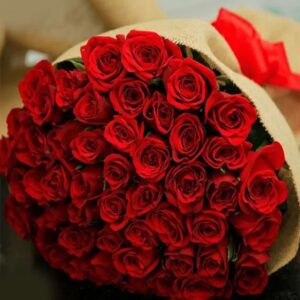 Rustic Romance – 75 Red Roses in Jute Wrap