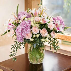 Whispers of Grace – 3 Pink Hydrangeas, 5 Pink Oriental Lilies, 10 Pink Carnations, 5 white Spray Roses