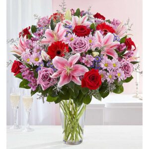 Velvet Symphony – Luxe All-Around Floral Arrangement
deep red and soft lavender Roses, fragrant pink Oriental Lilies, fiery red Gerbera Daisies, and delicate purple Alstroemeria,